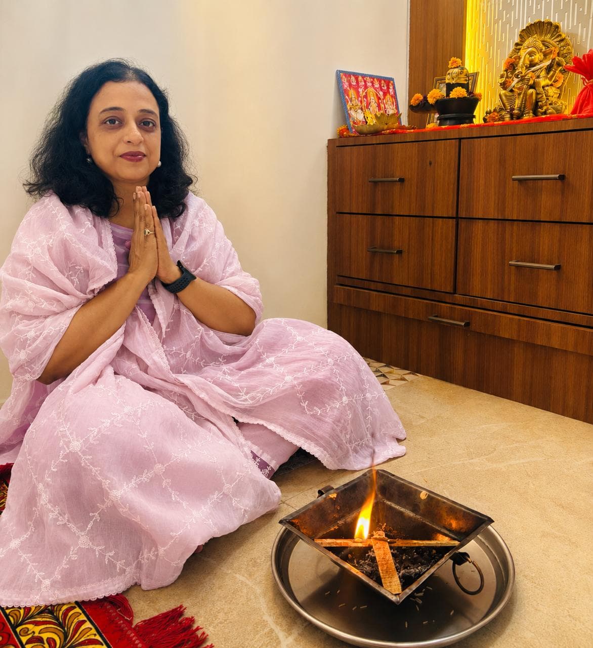 Richa Pathak preparing a ritual in the Powai pooja room